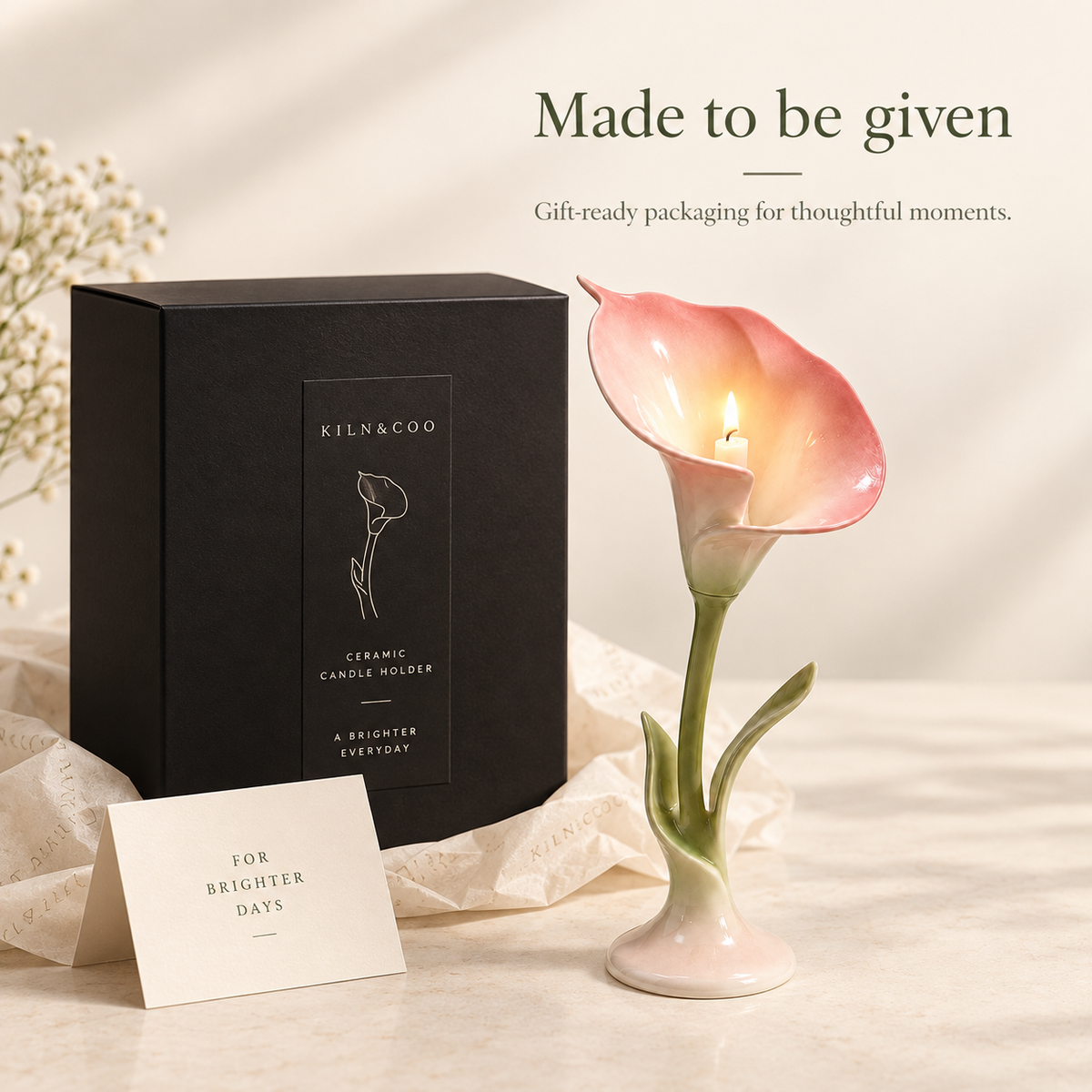 Calla lily ceramic candle holder presented with black KILN&COO gift-ready packaging.