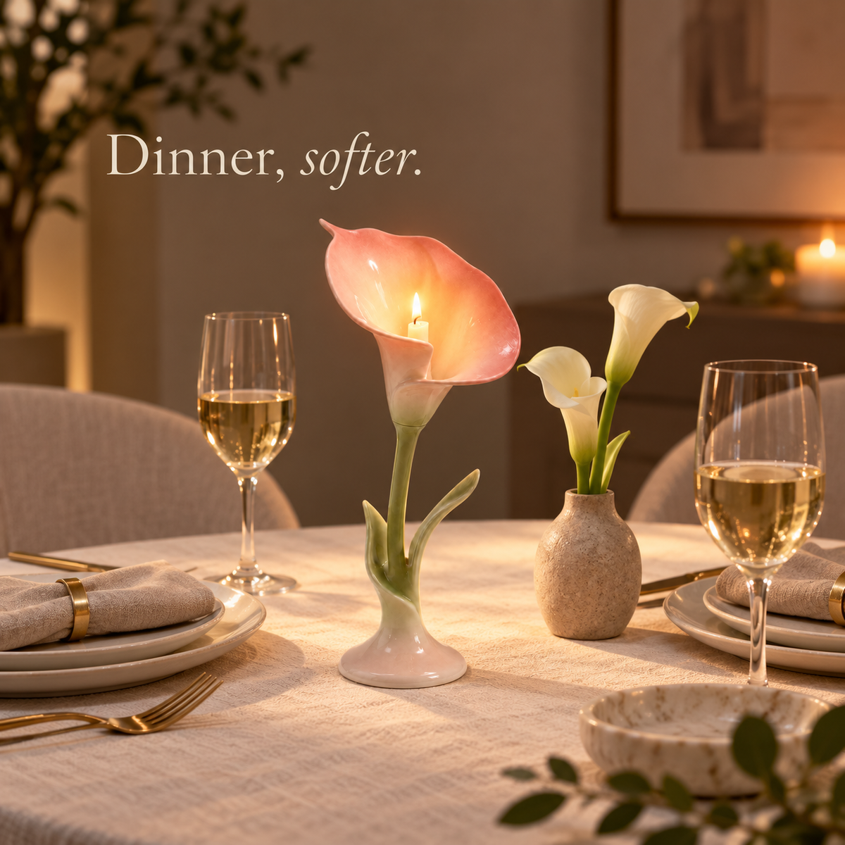 Calla lily ceramic candle holder glowing on an intimate modern dinner table for two.